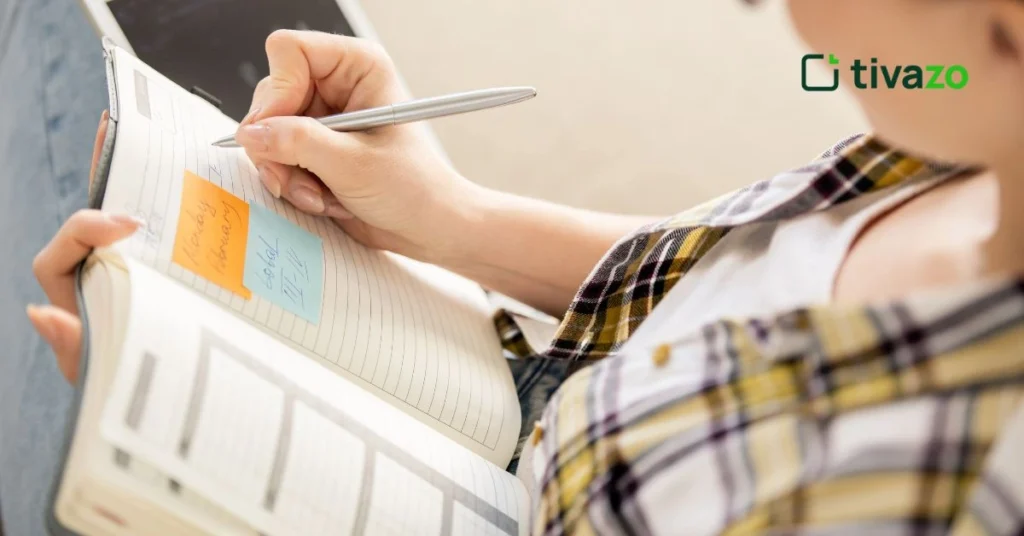 a girl writing 54321 methods of goal setting