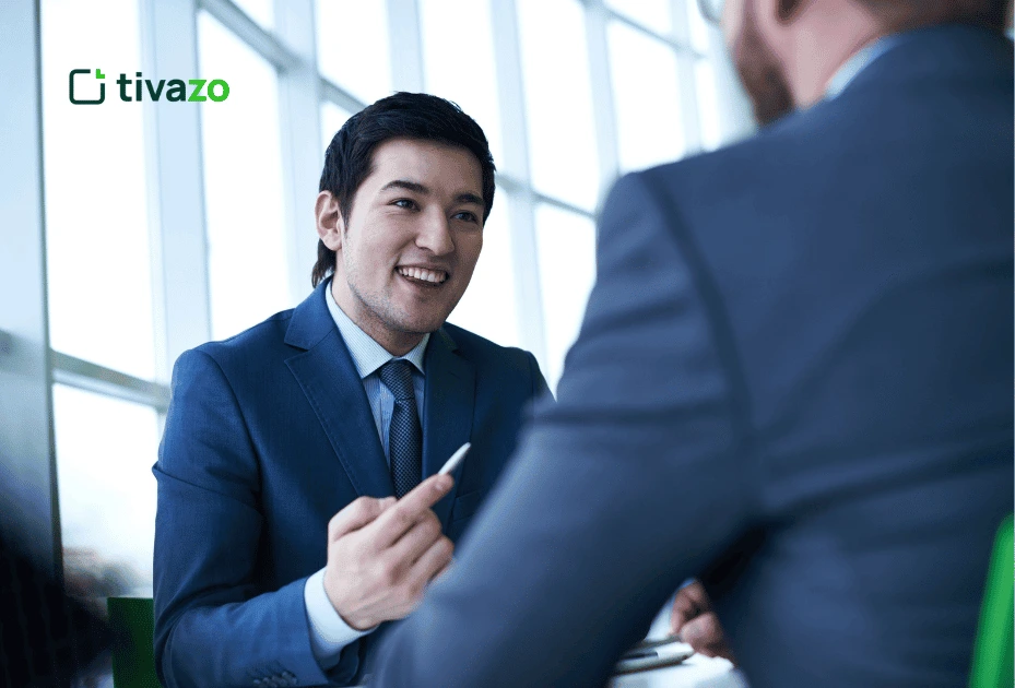 an employee communicating with collegue in office