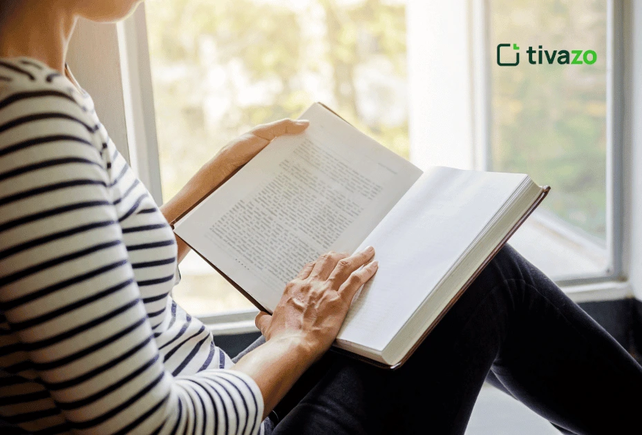 a girl reading in her bed